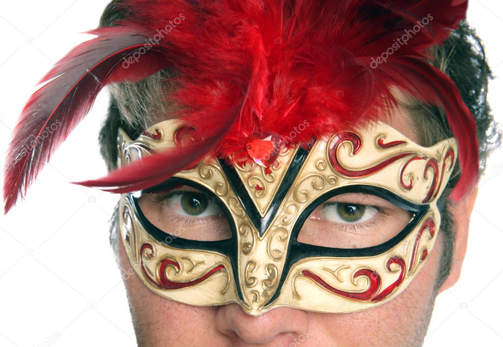 Man wearing masquerade mask