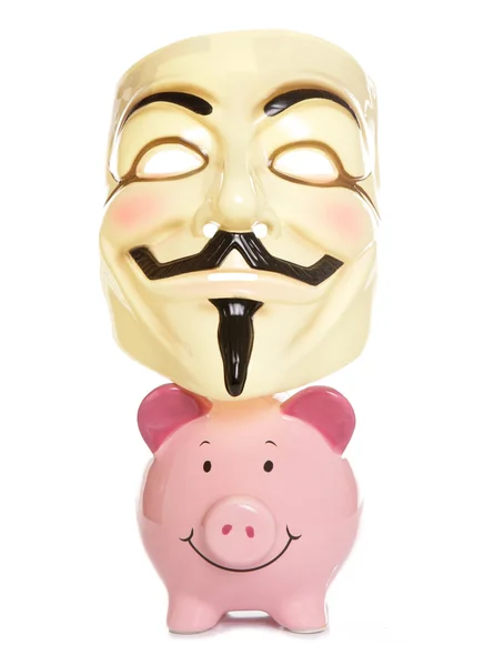Piggybank and guy fawkes mask — Stock Photo, Image