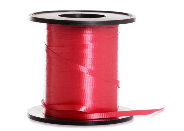 Red ribbon on a roll — Stock Photo, Image