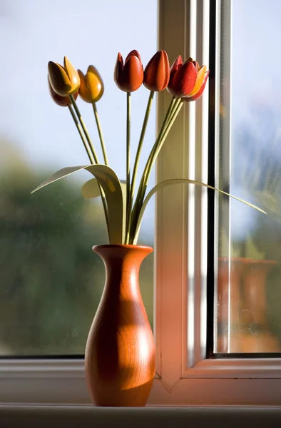 stock image Wooden tulips by window