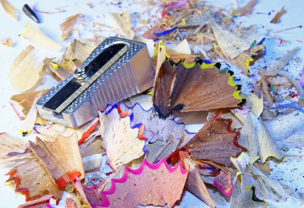 Colored pencils of wood chips after the sharpener — Stock Photo, Image