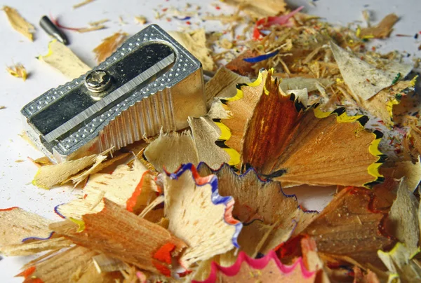 Colored pencils of wood chips after the sharpener — Stock Photo, Image