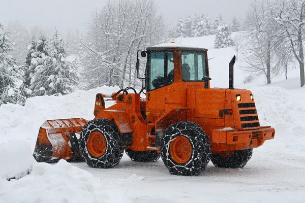 stock image Orange snow plows to work clearing the snow from the road