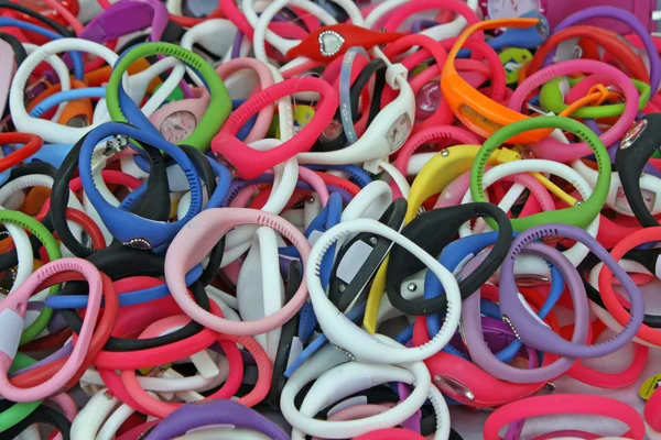 Colored rubber bracelets, watches for sale at the local market for kids — Stock Photo, Image