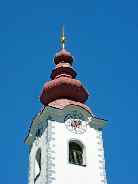 Austrian bell tower of a church with a typical onion-shaped roof — Stock Photo, Image