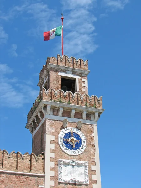 Bell tower with clock and Italian flag flying — Stock Photo, Image