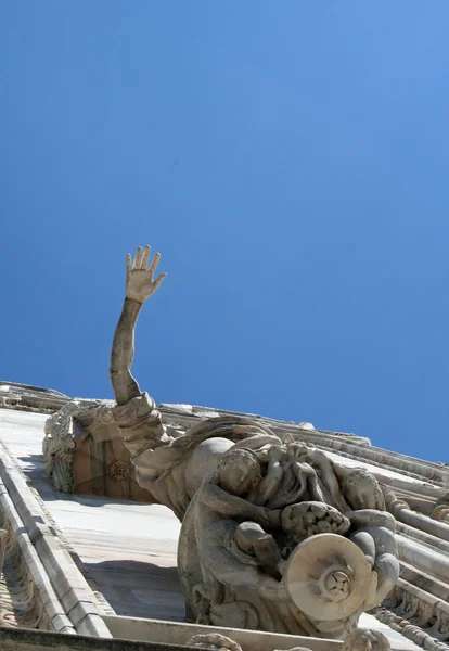 Hand of a statue in the spires of the duomo di milano in Italy — Stock Photo, Image