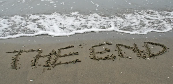 stock image The End Written on the beach by the sea