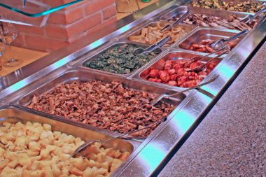 Tray of a self service buffet with vegetables clipart