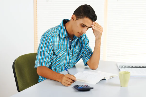 Young man trying to study — Stock Photo, Image