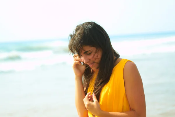 Stock image Smiling young lady talking on a cellphone