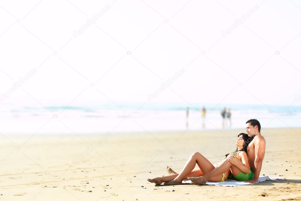 Couple lying on the beach