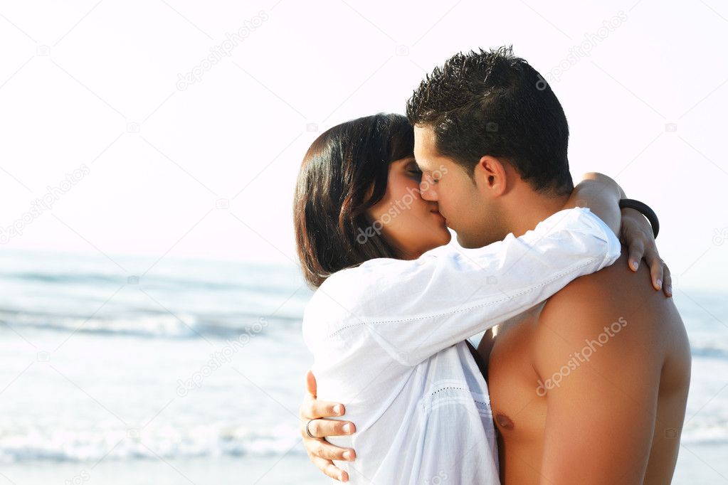 Adorable couple in love kissing and embracing each other