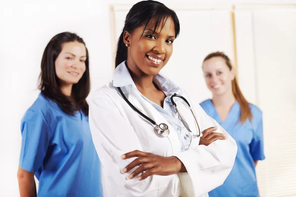 Doctor standing in front of his team Royalty Free Stock Images