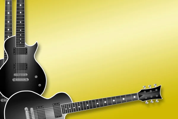 Три чёрные гитары на жёлтом фоне — стоковое фото