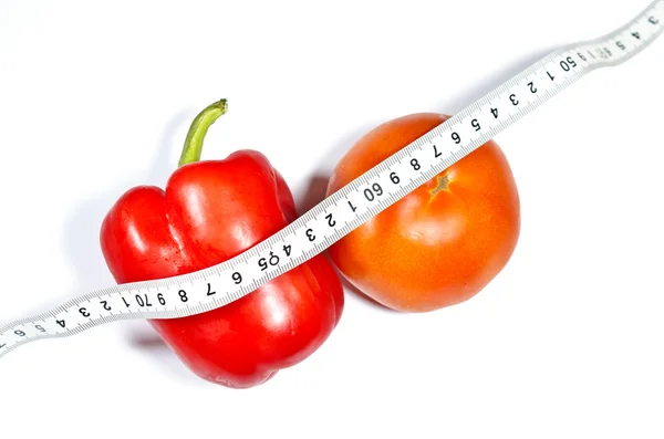 stock image Red pepper and tomato with measuretape on white