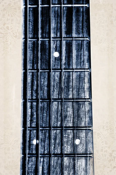 Kytara krk hmatník na podklad s texturou — Stock fotografie