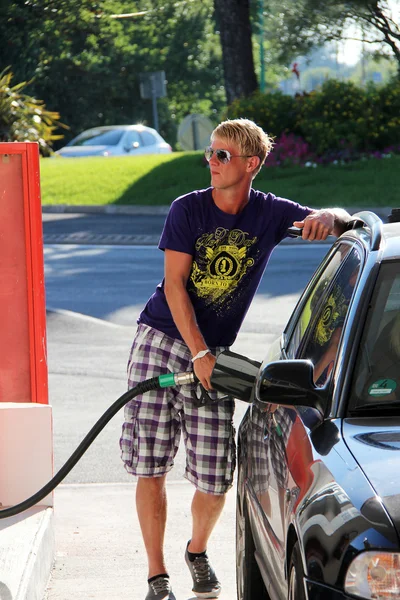 stock image Boy gets petrol