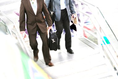 Business men on stairs clipart