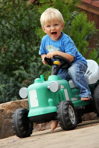 Little boy with tractor — Stock Photo, Image