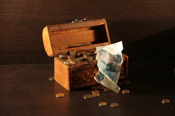 Stock image Wooden chest with coins