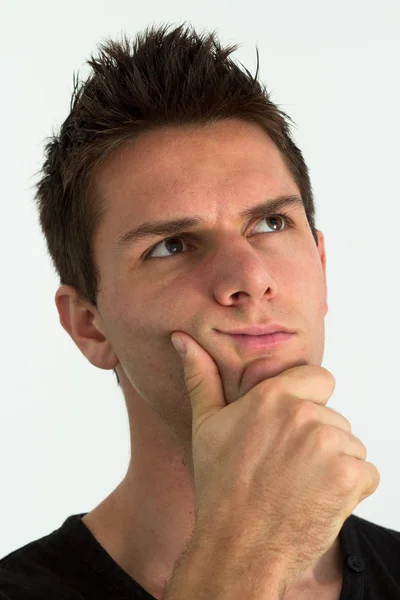 Muž myšlení s rukou na obličej — Stock fotografie