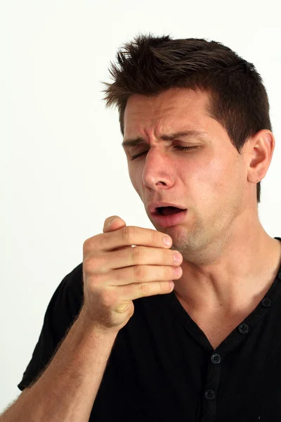Hombre enfermo tosiendo en su mano Imagen de stock