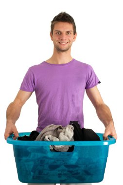 Young man doing the laundry clipart