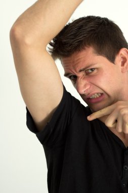 Man smelling bady under he's armpits and pointing there with his finge clipart