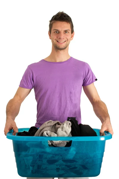 Jovem fazendo a lavanderia — Fotografia de Stock