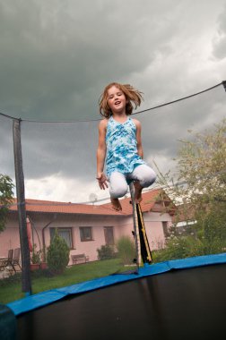 Big fun - child jumping trampoline clipart