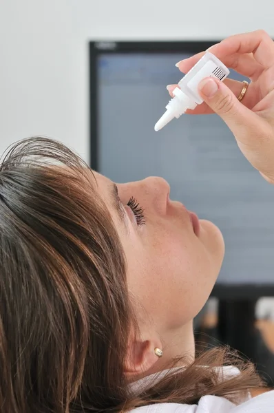 stock image Young business woman applying eyes drops