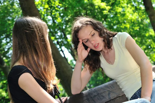 Friends - one teenage girl comforts another — Stock Photo, Image
