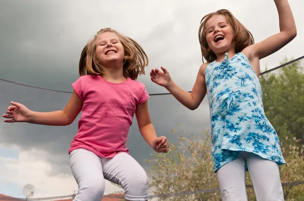 Big fun - childdren jumping trampoline — Stock Photo, Image