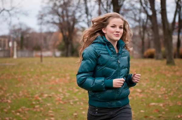 Autumn jogging - young woman — Stock Photo, Image