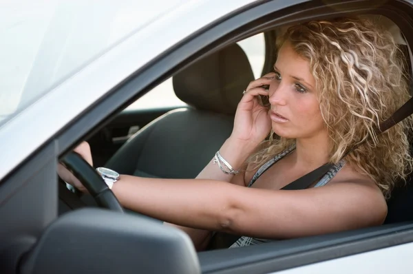Portrait of young woman driving car — Stock Photo, Image