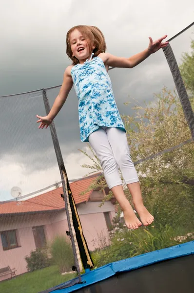 Big fun - child jumping trampoline — Stock Photo, Image