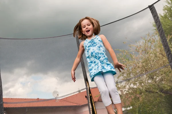 Big fun - child jumping trampoline — Stock Photo, Image