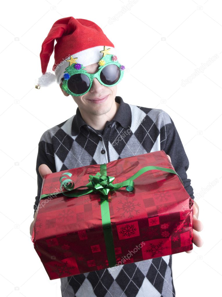Man in Christmas party glasses and hat holds red gift box