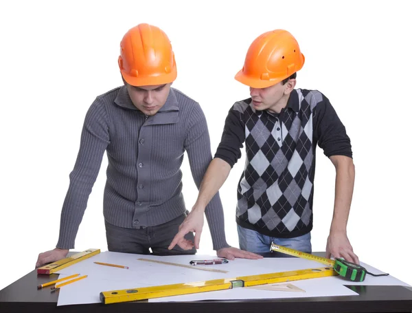 Achitects standing over table with blueprints, rulers and pencil — Stock Photo, Image