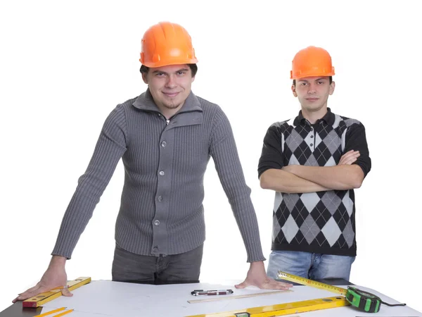 Architects standing over blueprints — Stock Photo, Image