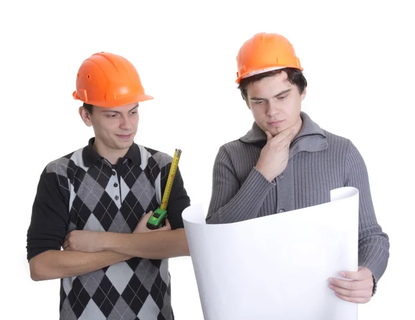 Achitects looking on a blueprints — Stok fotoğraf