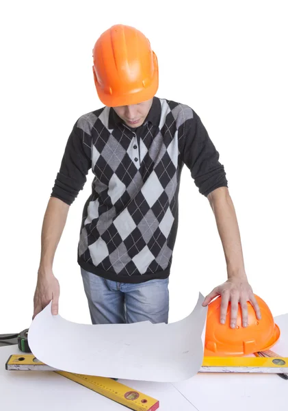 Architect looking on a blueprints — Stock Photo, Image