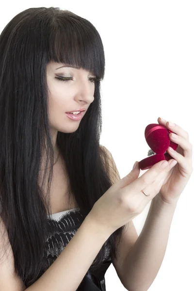 Beautiful woman with gift in heart-shaped box — Stock Photo, Image