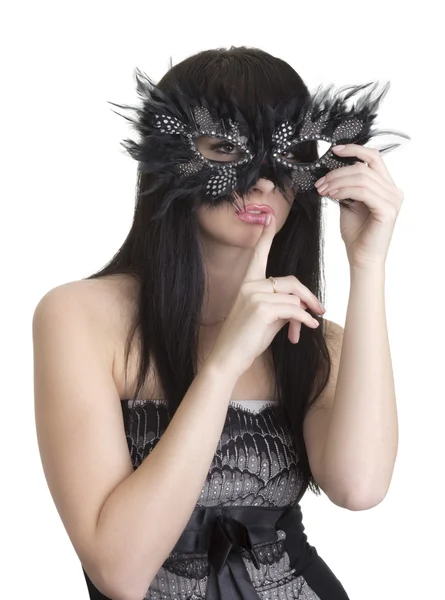 stock image Beautiful woman with mask and finger near lips