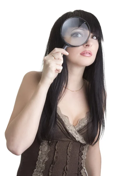 Krásná žena hospodářství zvětšovací sklo — Stock fotografie