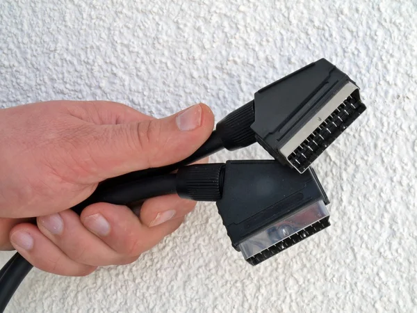 SCART connector in the hand — Stock Photo, Image