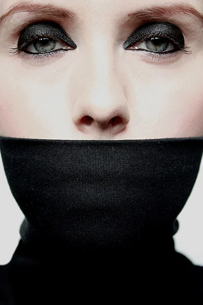 Young woman with covered mouth — Stock Photo, Image