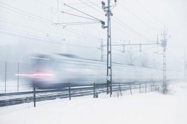 Train in snow storm clipart