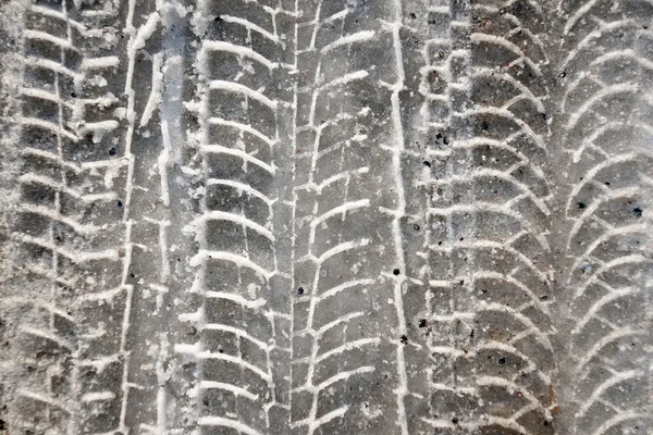 Pistas de neumáticos en la nieve —  Fotos de Stock
